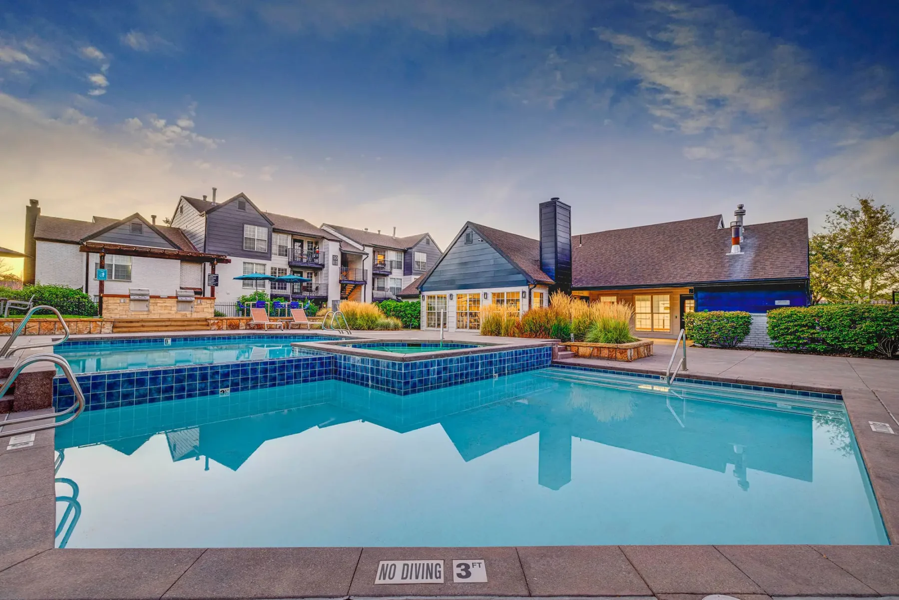 Hot tub by the pool and grill stations