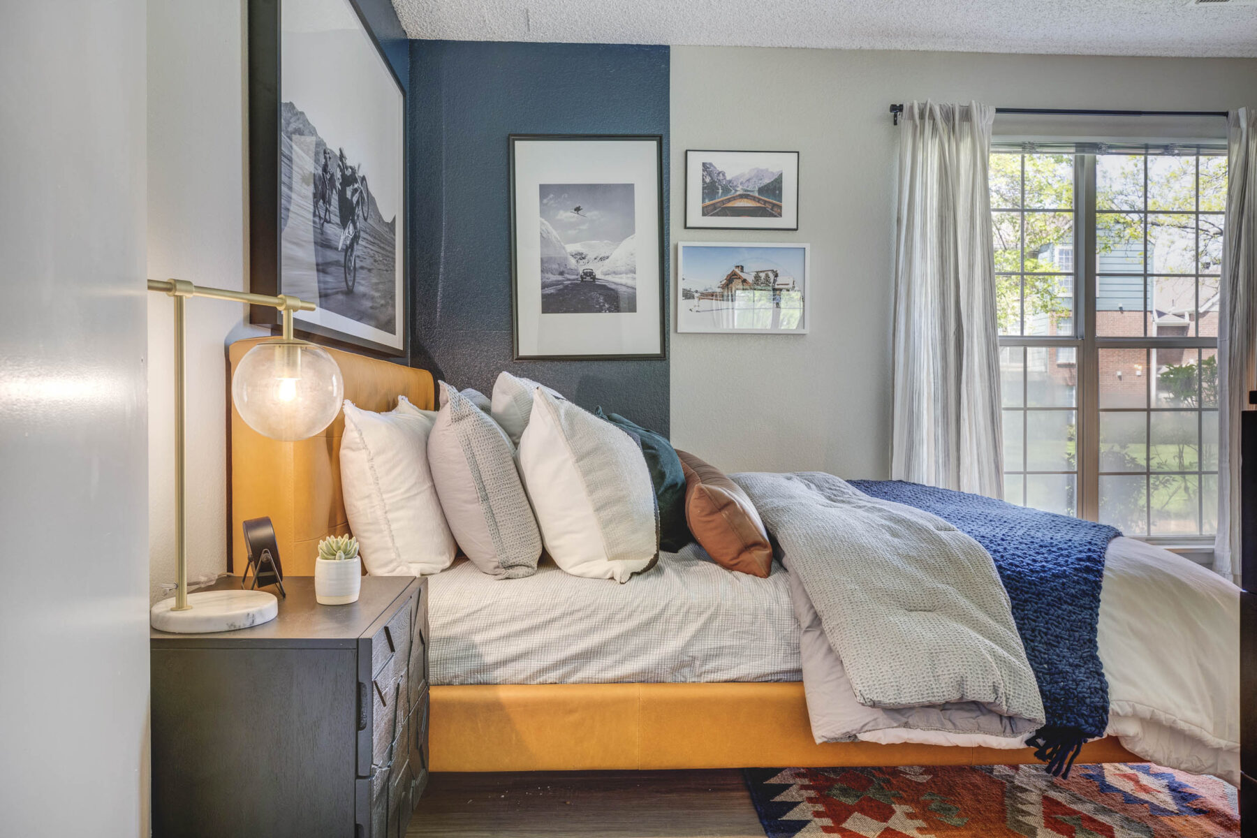 Staged Bedroom with accent wall and large windows