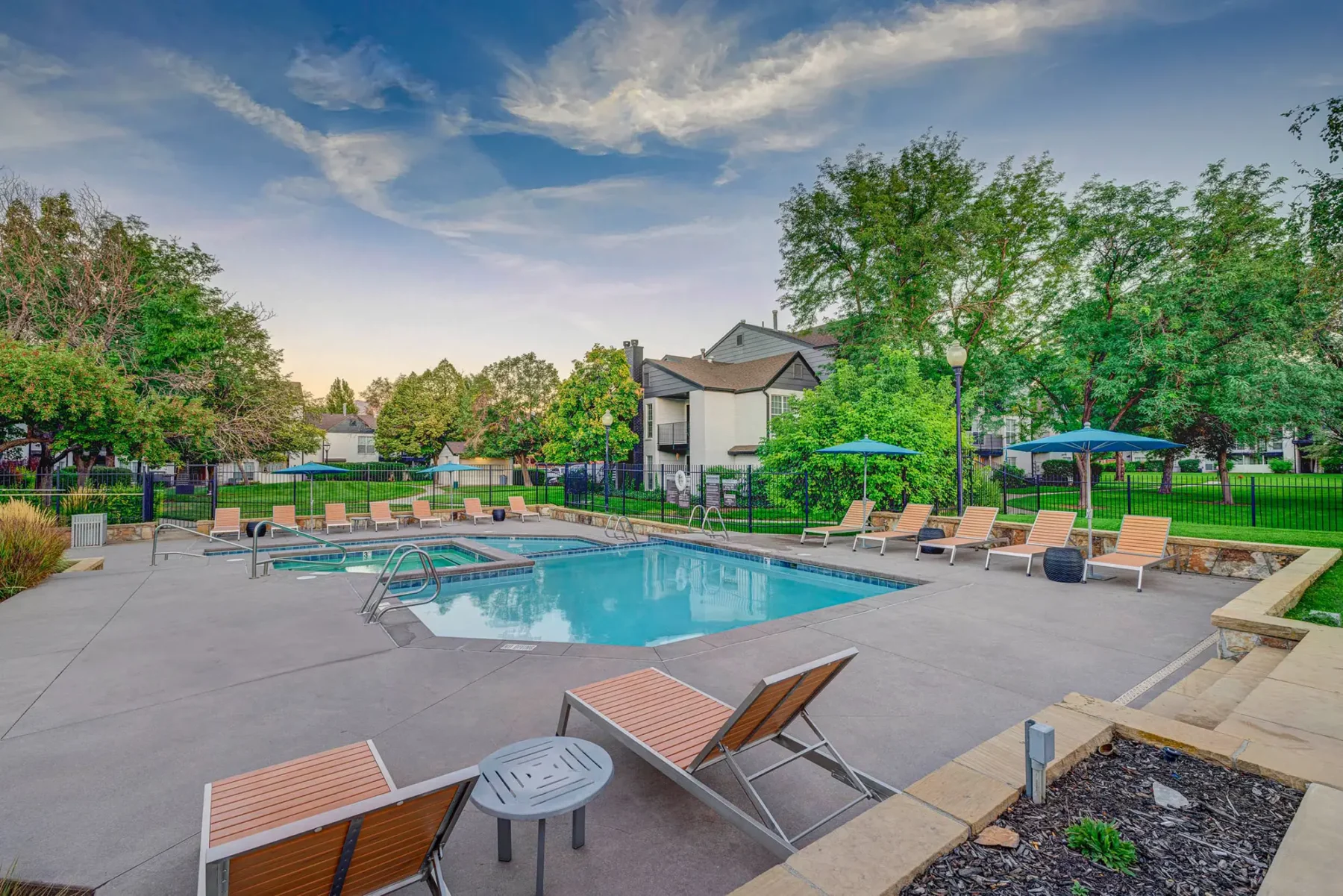 Pool deck with hot tub and covered seating