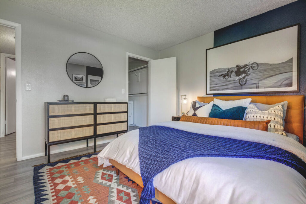 Bedroom with walk in closet and washer/dryer in the closet