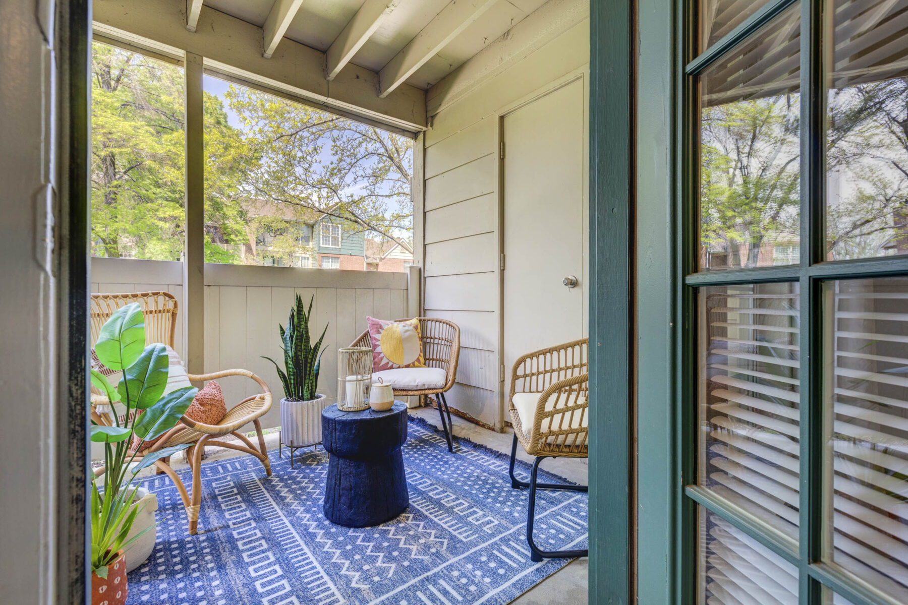 Private patio with privacy screen and storage closet